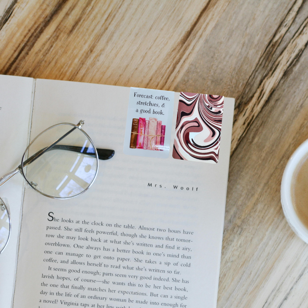 Double-sided magnetic bookmark showing front coffee quote and patterned back on open book