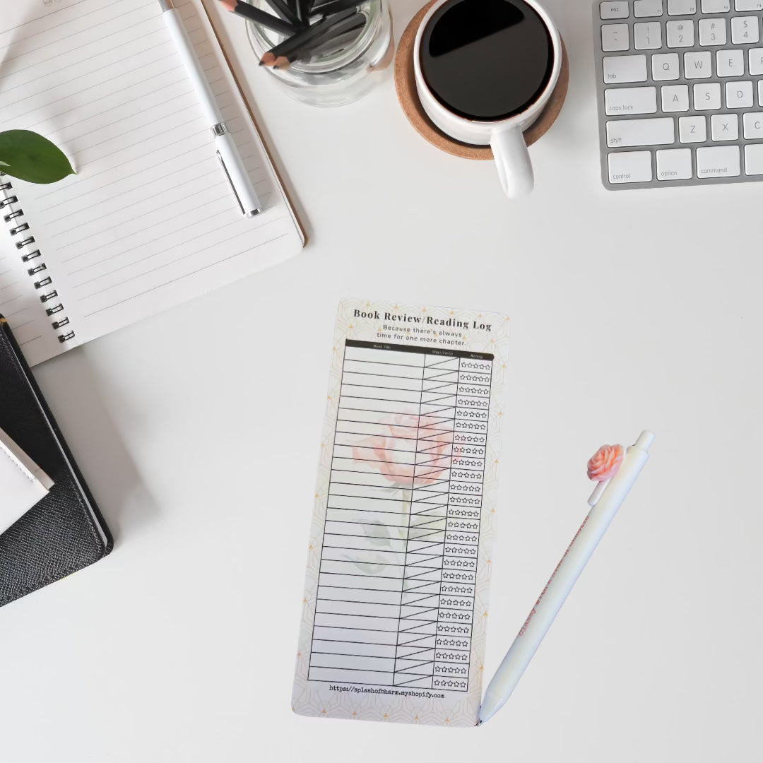 Desktop with reading log and pen.