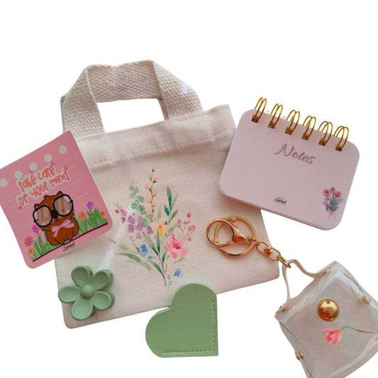 Cozy mini accessory bundle featuring floral stationery, tiny tote bag, and soft everyday self-care details
