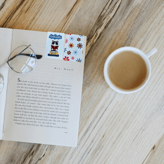 Cute magnetic bookmark with a book-loving cat on an open book next to coffee, perfect for cozy readers and book lovers