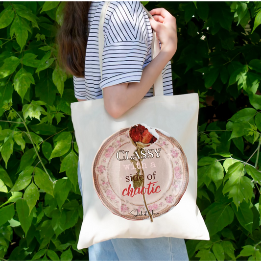 Woman carrying a shoulder bag on her shoulder with a vintage plate with a red rose in the background with the words "classy with a side of chaos."