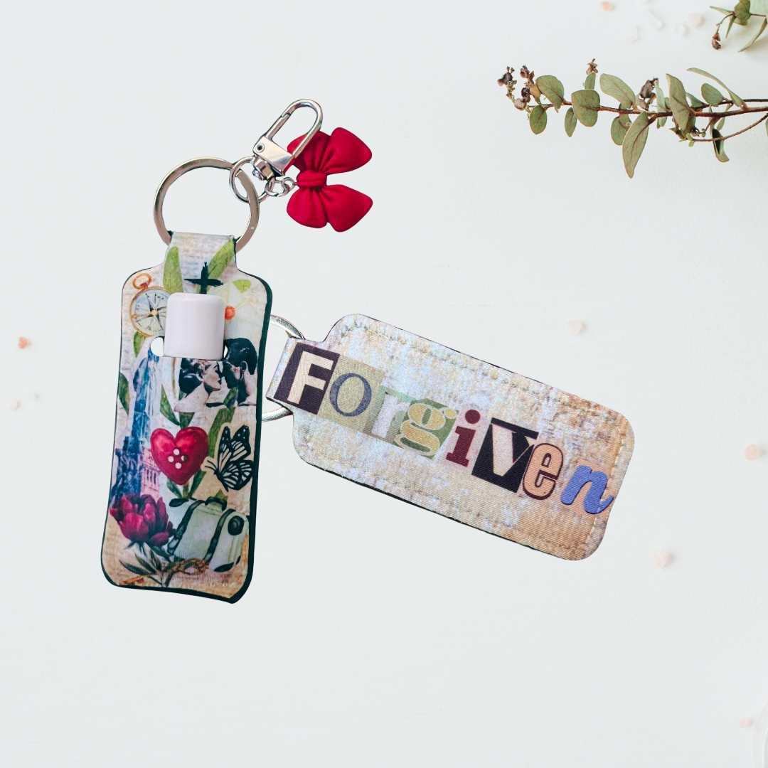 Inspirational chapstick holder keychain holding lip balm attached to clip on white background