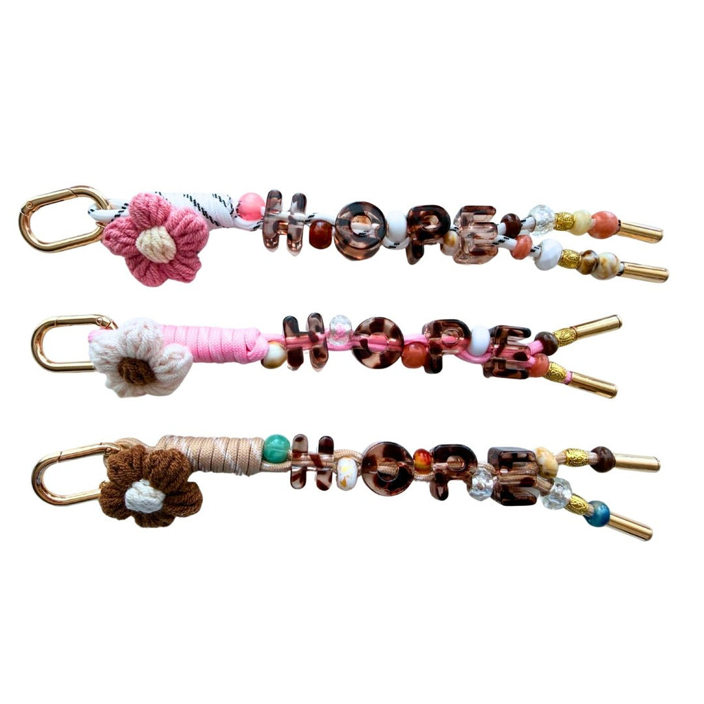 HOPE paracord bag charms with gold carabiners, flower charms and coordinating beads
