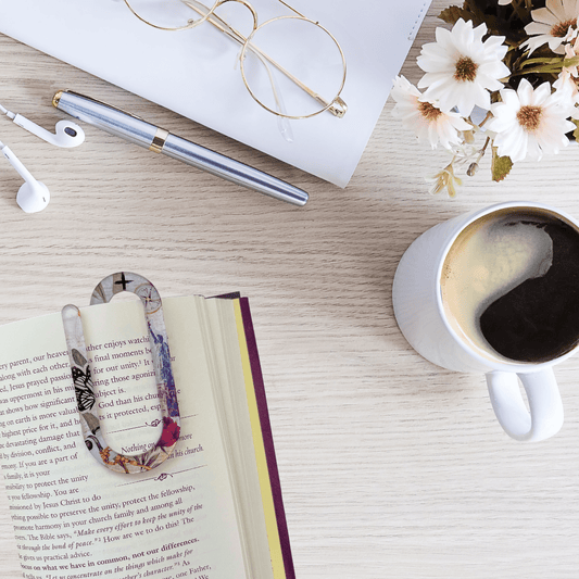Jumbo acrylic paper clip bookmark with floral faith design clipped onto book page