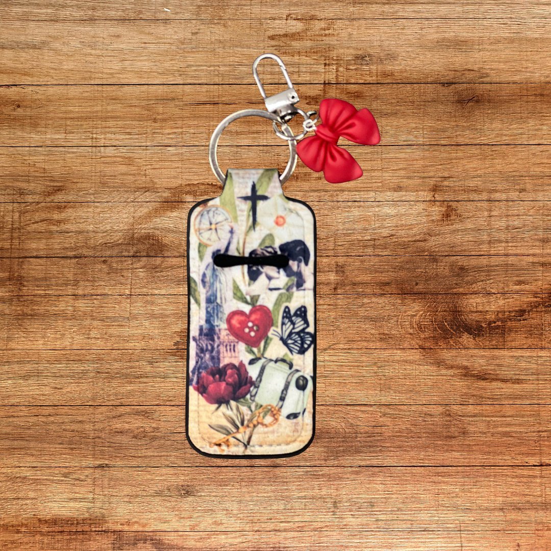 Neoprene lip balm holder keychain with forgiven design and red bow charm on wood background