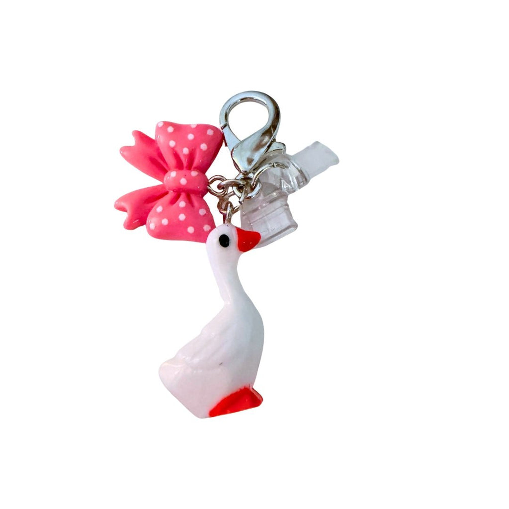 Phone dust cover charm with a white goose, pink polka-dot bow, and silver lobster clasp