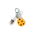 Phone dust cover charm with a chocolate chip cookie, milk bottle, and silver lobster clasp