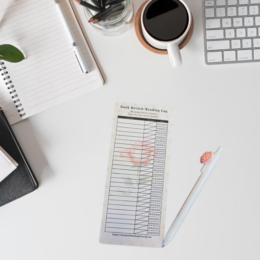 Desktop with reading log and pen.