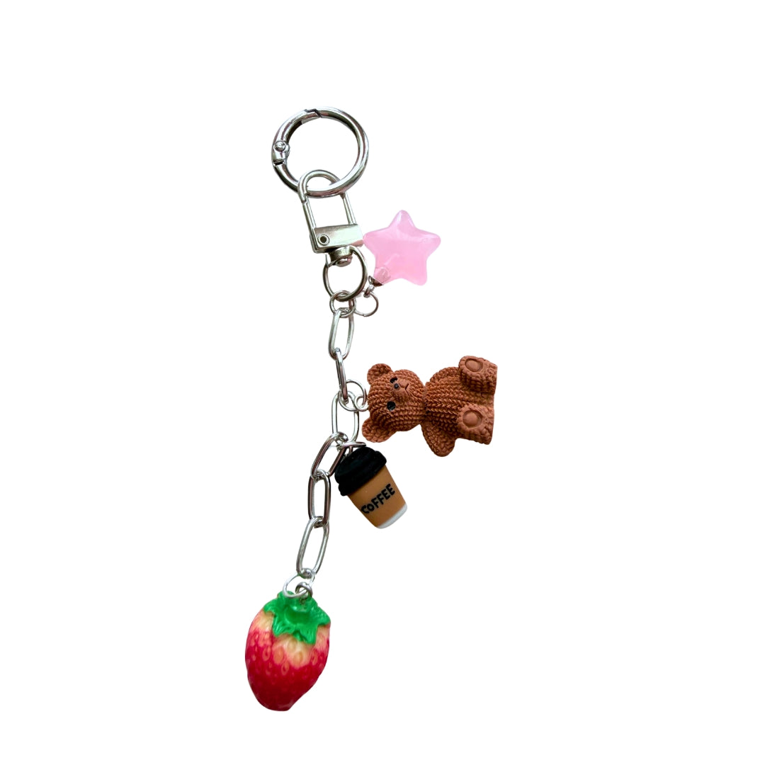 Handmade Strawbear purse charm with teddy bear, strawberry, coffee cup, and pink star charms on a silver-tone chain.