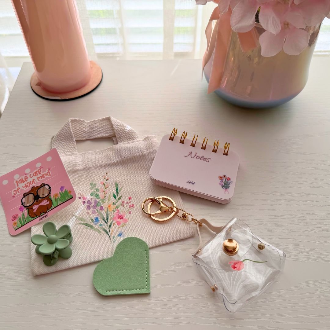 Tiny Tote Self-Care Bundle styled with mini tote, notepad, hair clip, charm accessories, and cozy pink aesthetic