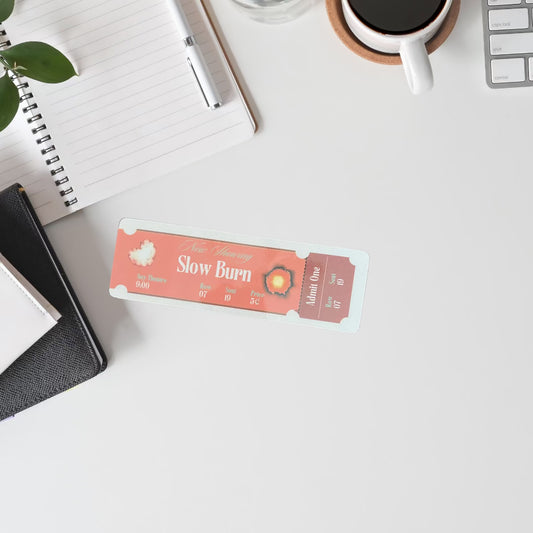 Desktop with laminated bookmark on top.